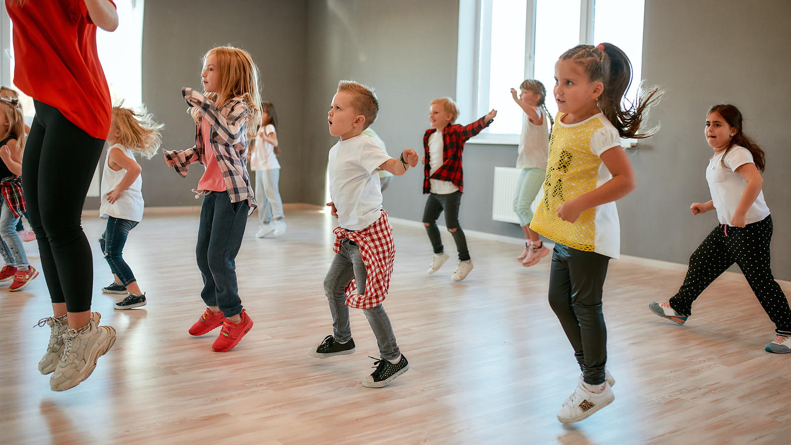 Group Of Little Boys And Girls Dancing While Having Choreography